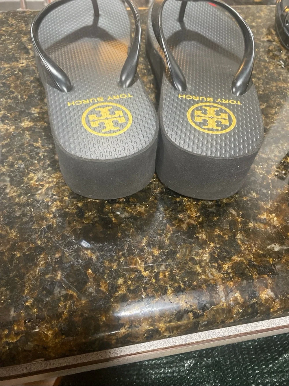 Tory Burch Black Flip Flop Sandals with Gold Logo Medallion